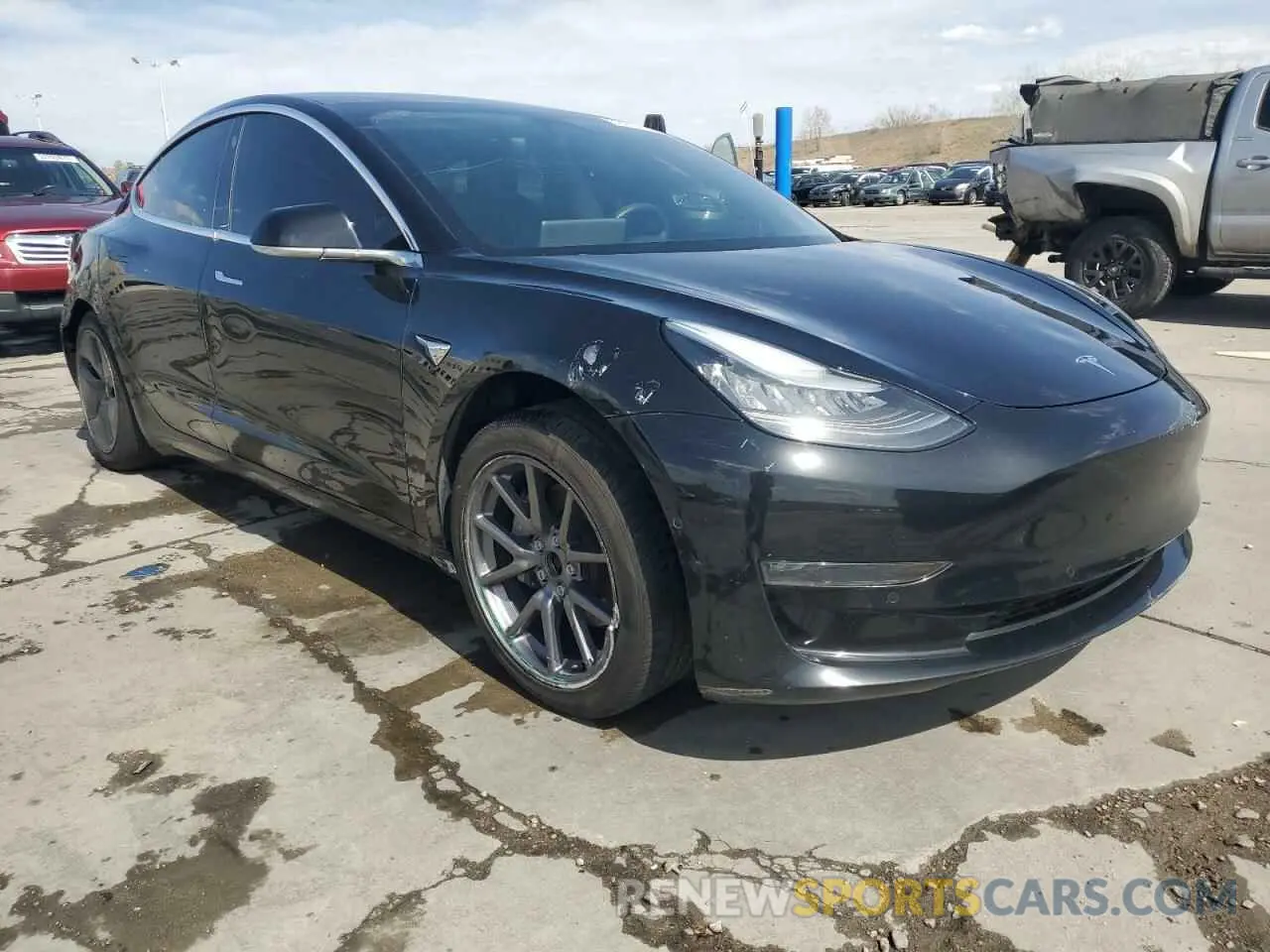 4 Photograph of a damaged car 5YJ3E1EB4LF599909 TESLA MODEL 3 2020