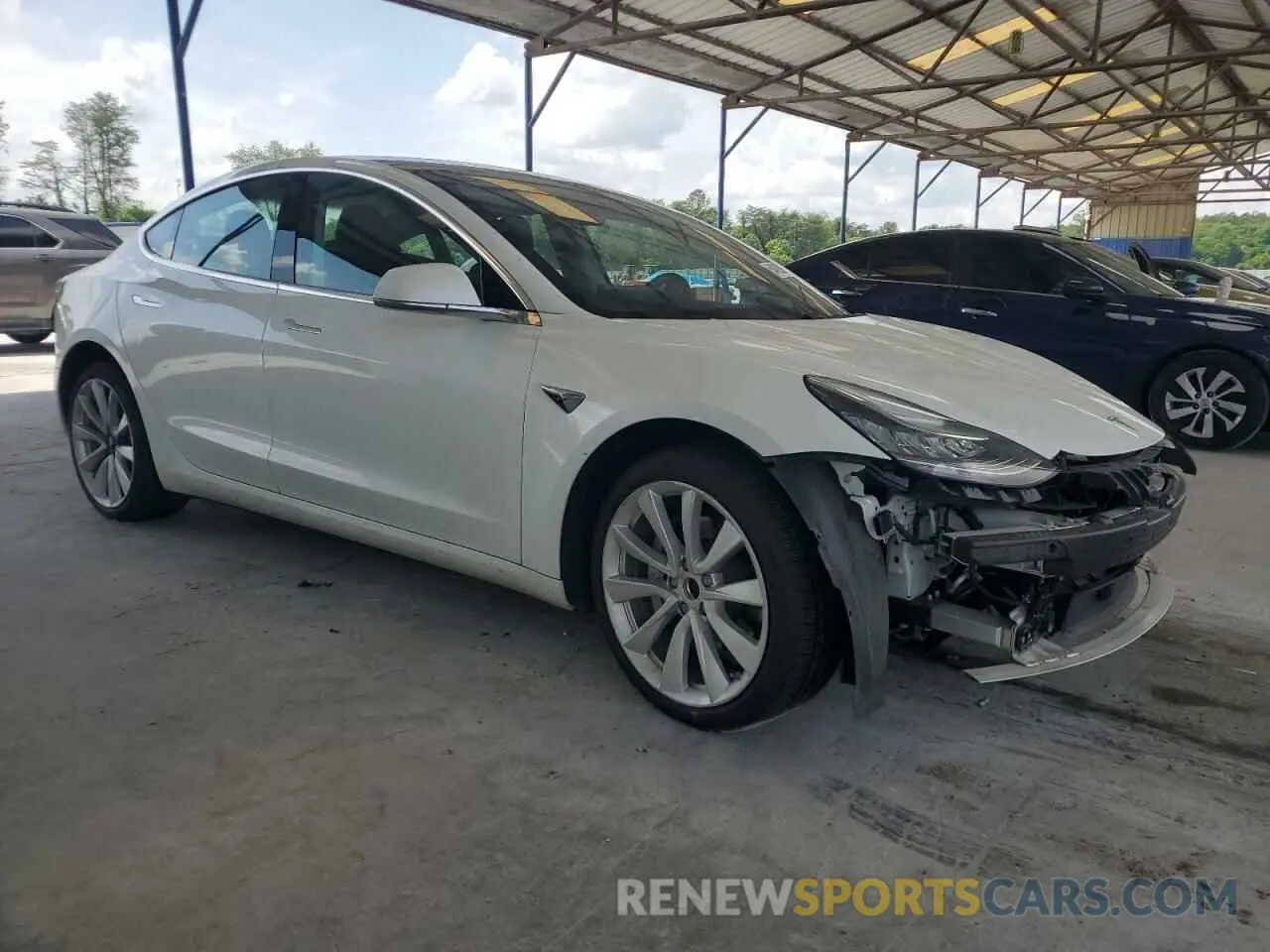 4 Photograph of a damaged car 5YJ3E1EB4LF638577 TESLA MODEL 3 2020