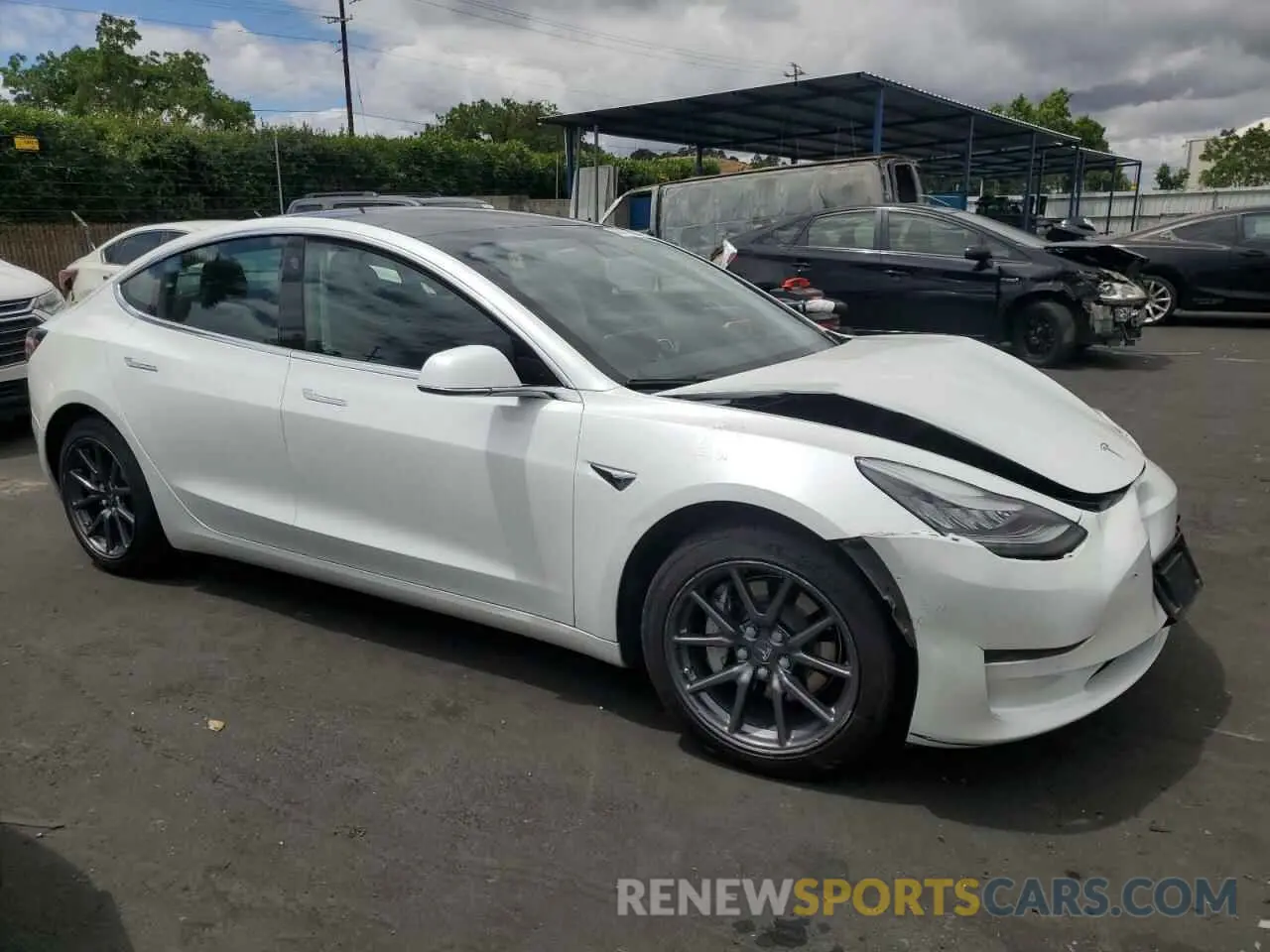 4 Photograph of a damaged car 5YJ3E1EB7LF619411 TESLA MODEL 3 2020