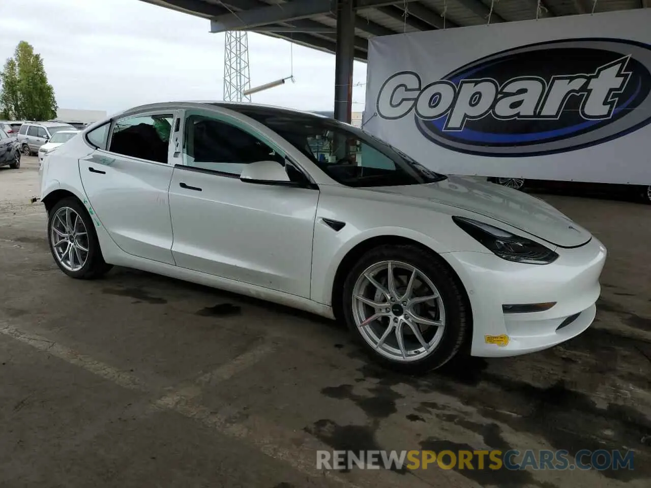 4 Photograph of a damaged car 5YJ3E1EA1MF072130 TESLA MODEL 3 2021