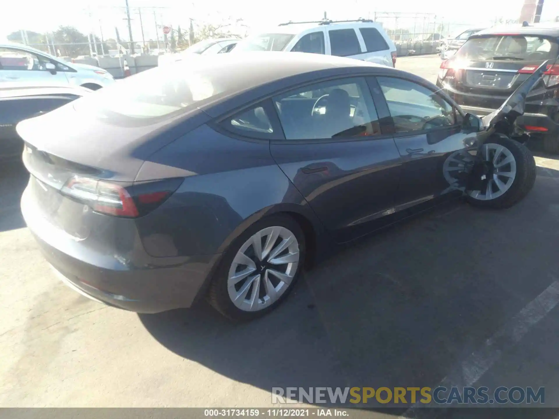 4 Photograph of a damaged car 5YJ3E1EA2MF927854 TESLA MODEL 3 2021