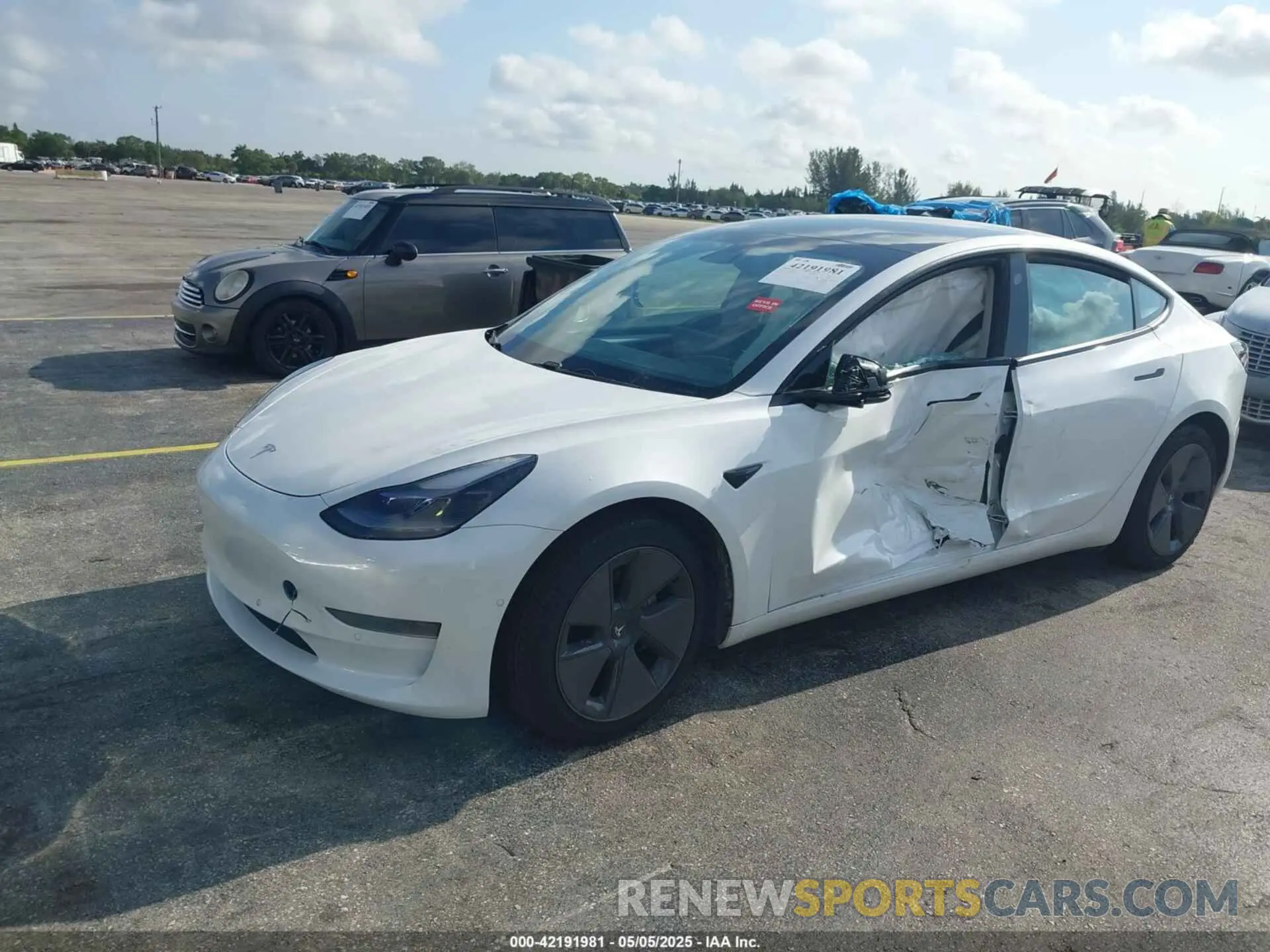 2 Photograph of a damaged car 5YJ3E1EA2MF973202 TESLA MODEL 3 2021