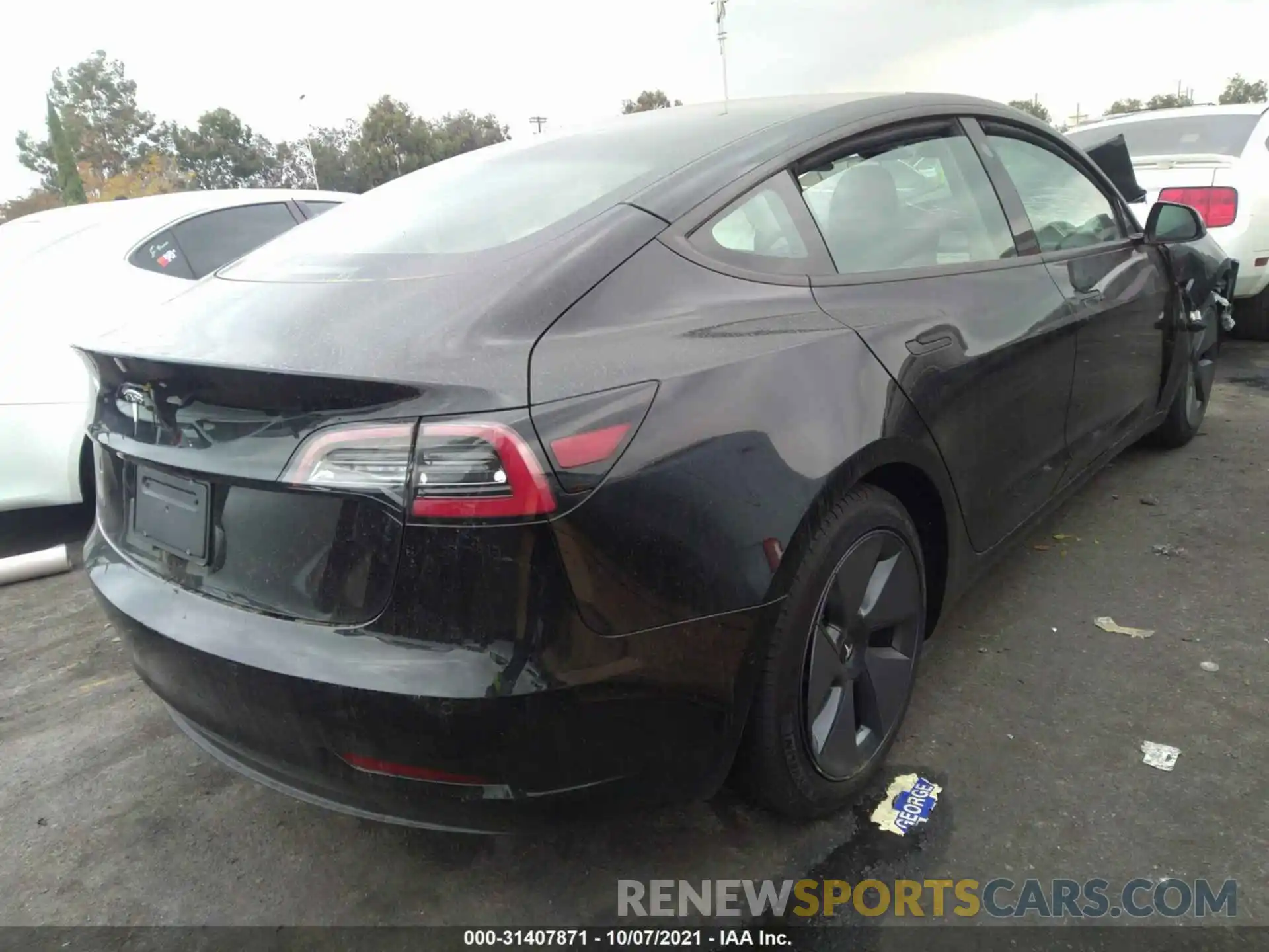 4 Photograph of a damaged car 5YJ3E1EA3MF002760 TESLA MODEL 3 2021