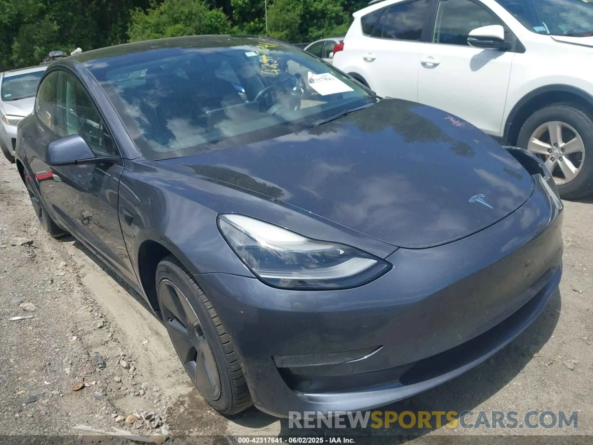 1 Photograph of a damaged car 5YJ3E1EA3MF086885 TESLA MODEL 3 2021