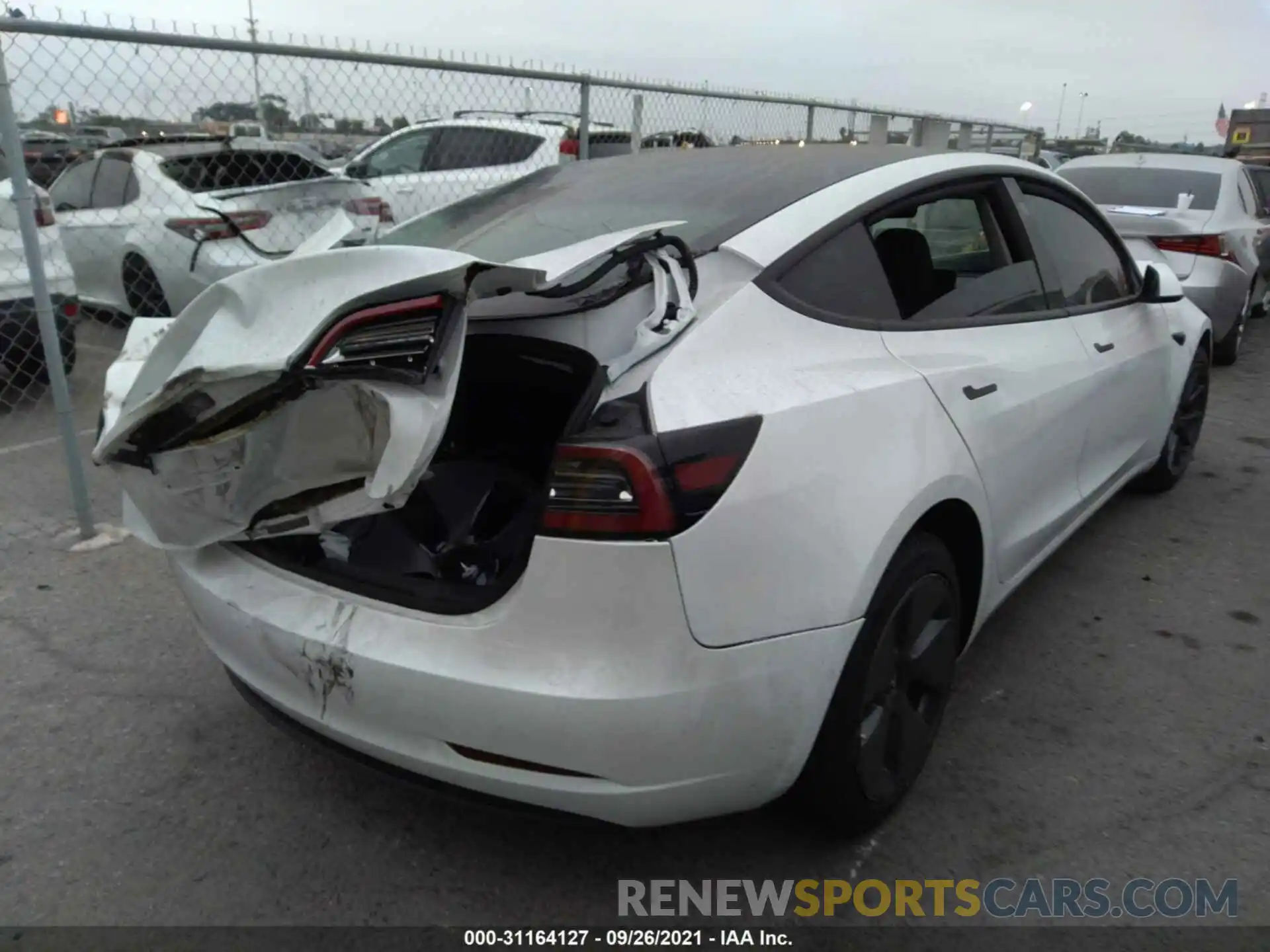 4 Photograph of a damaged car 5YJ3E1EA4MF873909 TESLA MODEL 3 2021