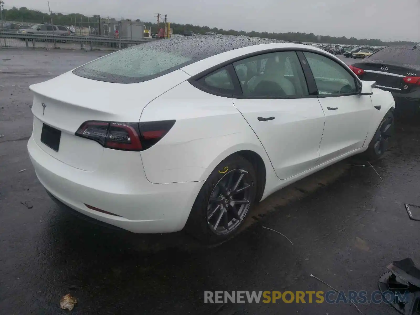 4 Photograph of a damaged car 5YJ3E1EA4MF989823 TESLA MODEL 3 2021