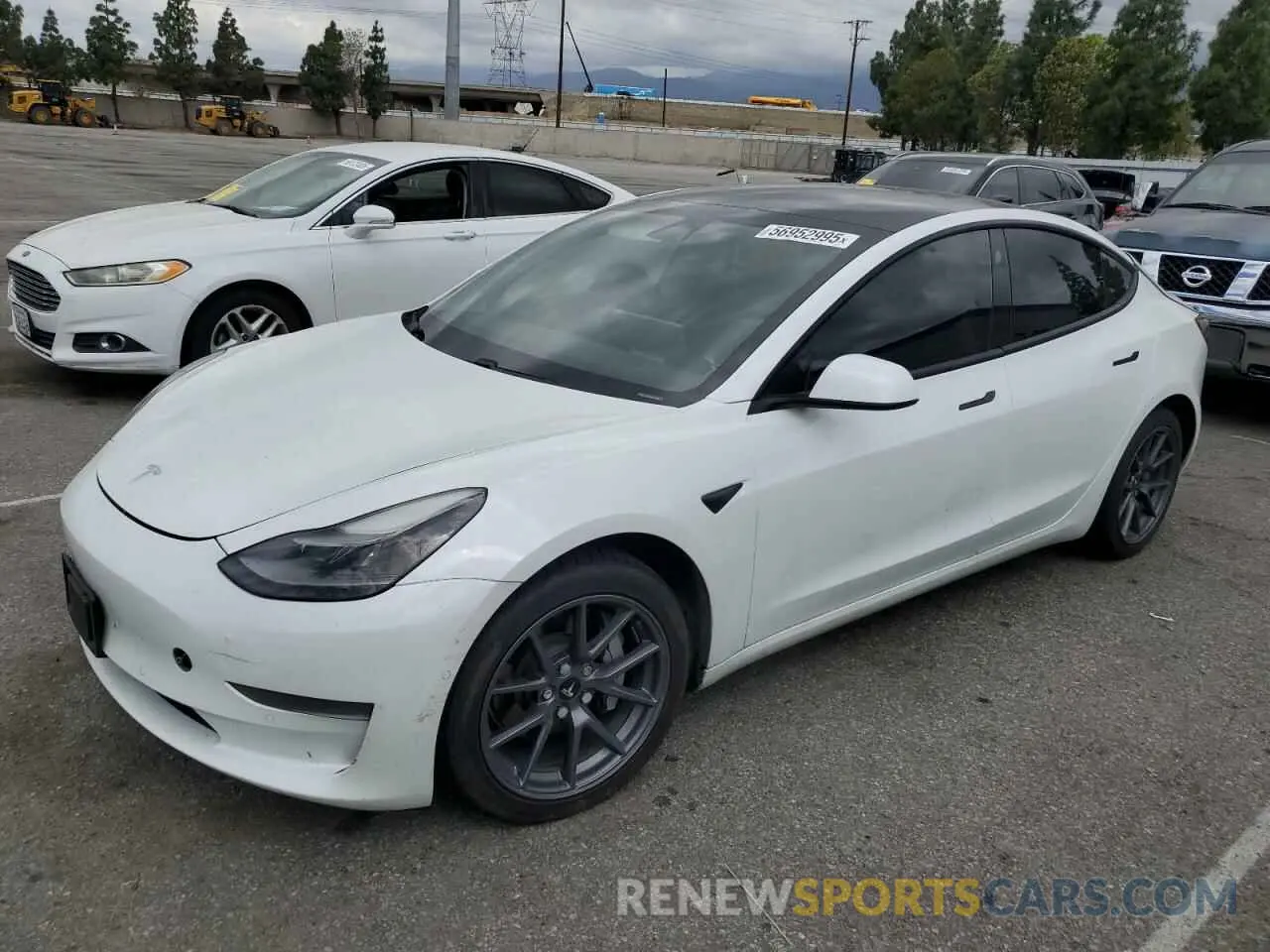 1 Photograph of a damaged car 5YJ3E1EA5MF874213 TESLA MODEL 3 2021
