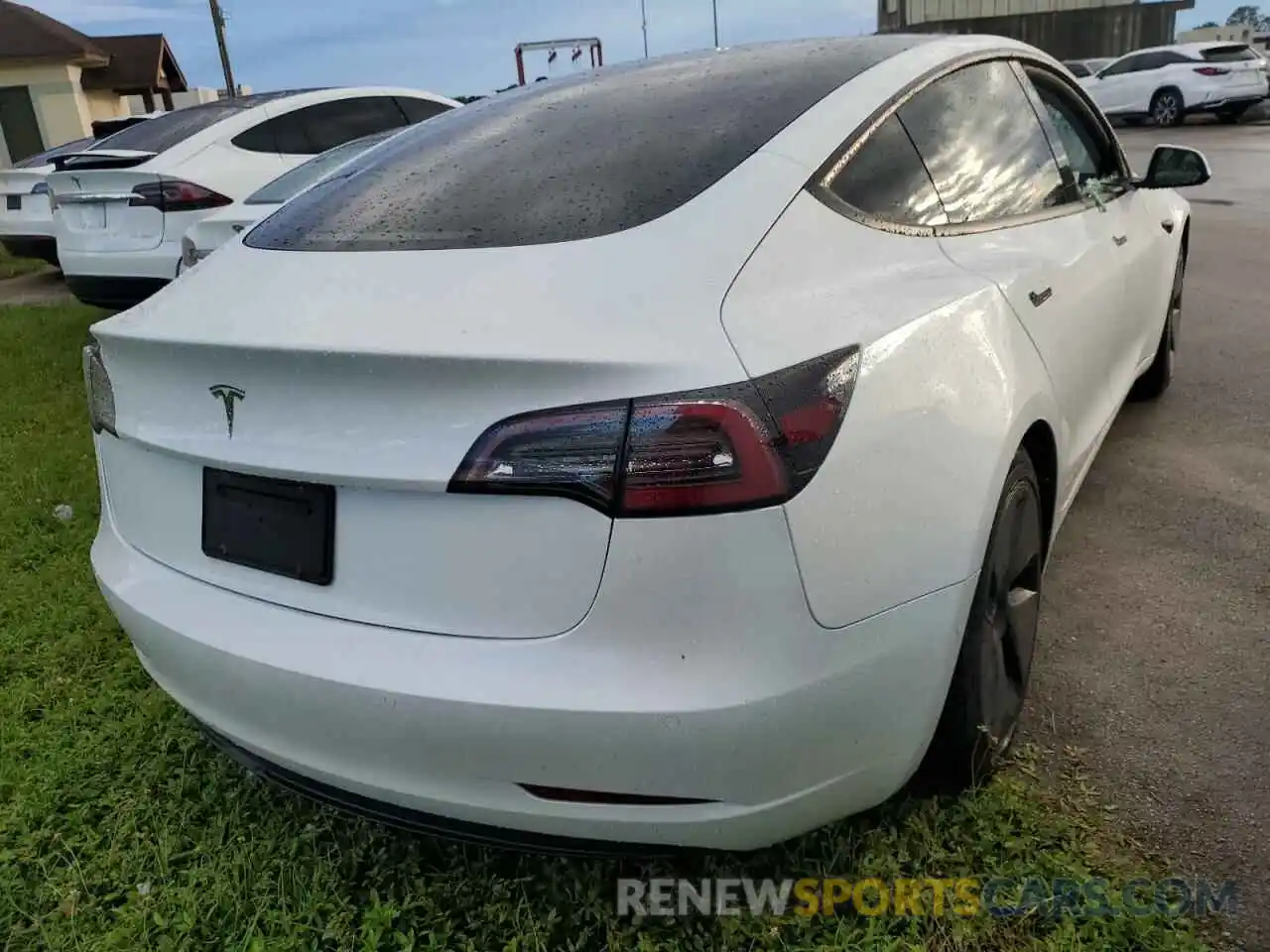 4 Photograph of a damaged car 5YJ3E1EA6MF911608 TESLA MODEL 3 2021