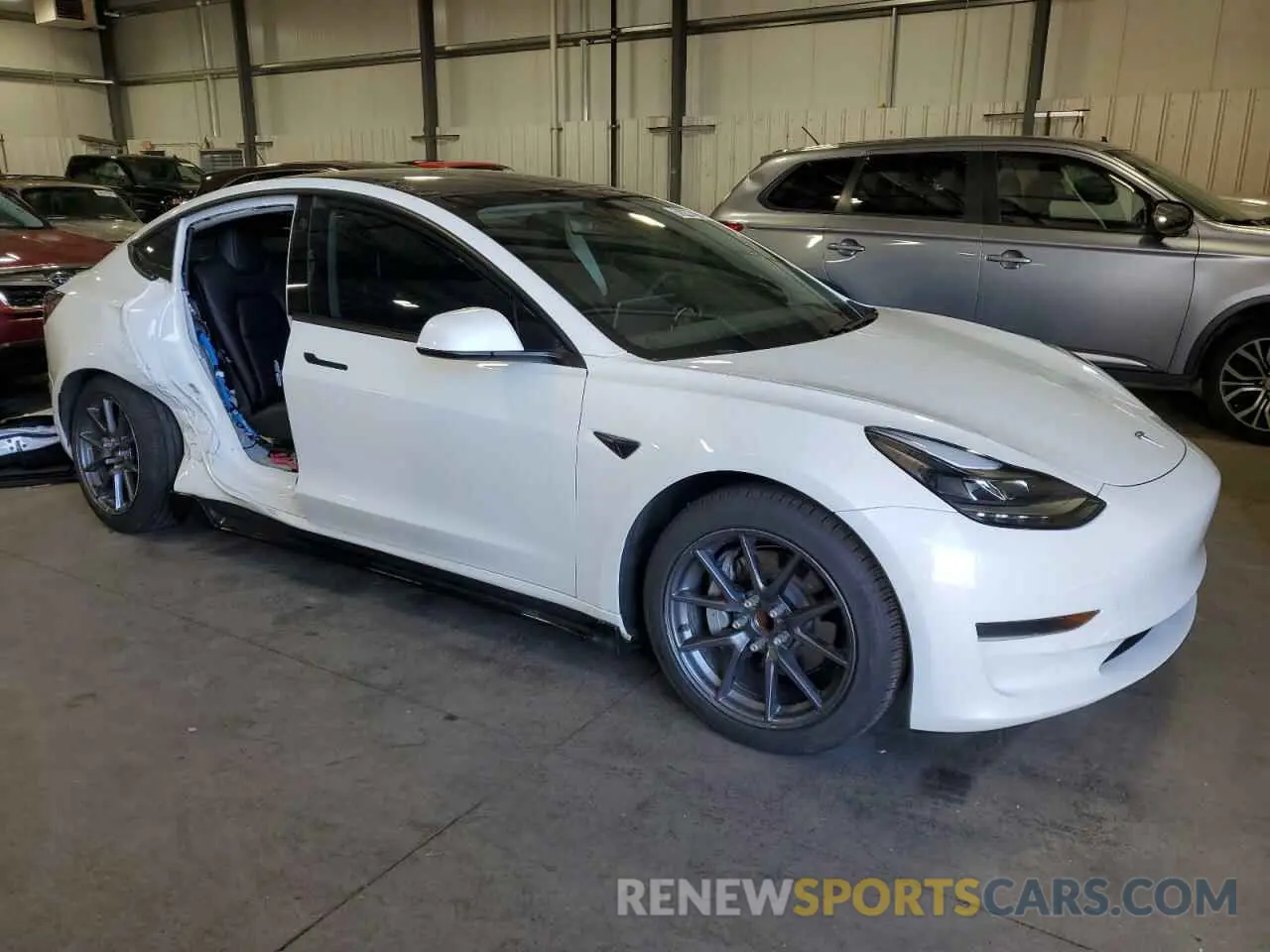 4 Photograph of a damaged car 5YJ3E1EAXMF991558 TESLA MODEL 3 2021