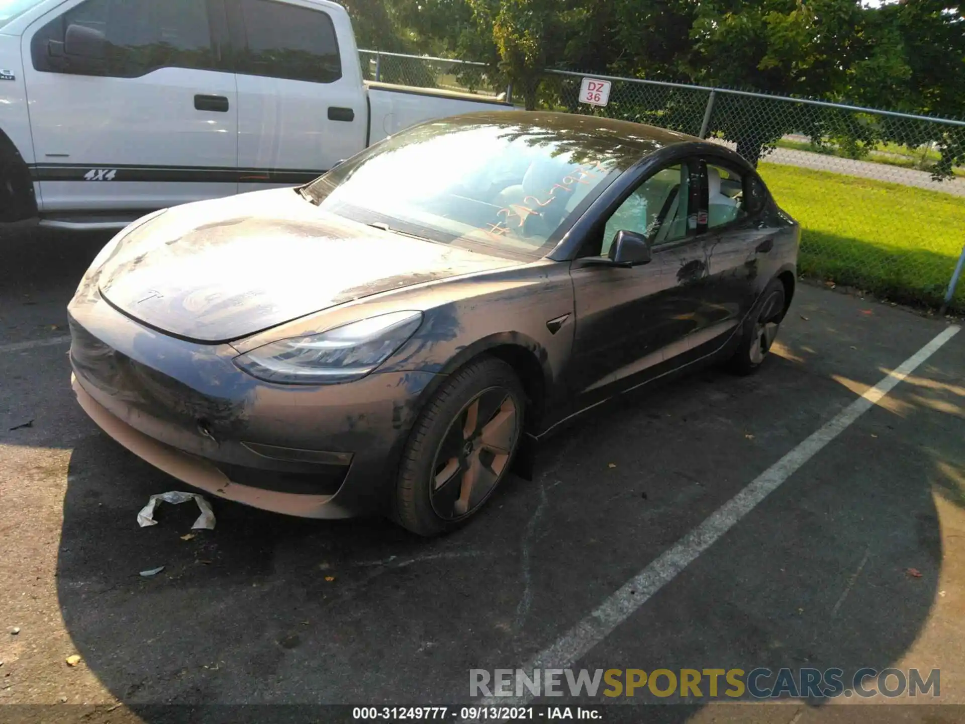 2 Photograph of a damaged car 5YJ3E1EB2MF852646 TESLA MODEL 3 2021