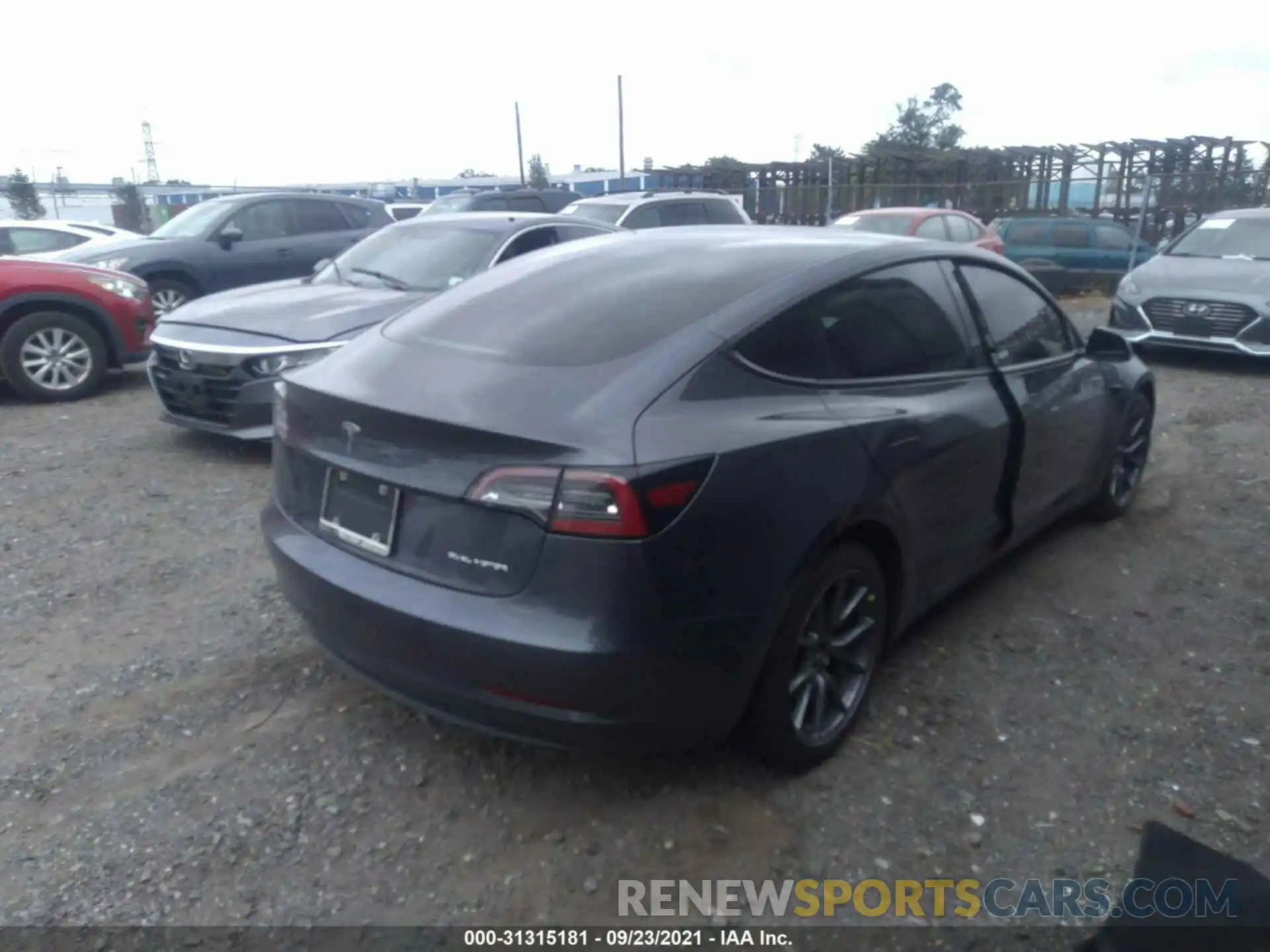 4 Photograph of a damaged car 5YJ3E1EB2MF858026 TESLA MODEL 3 2021