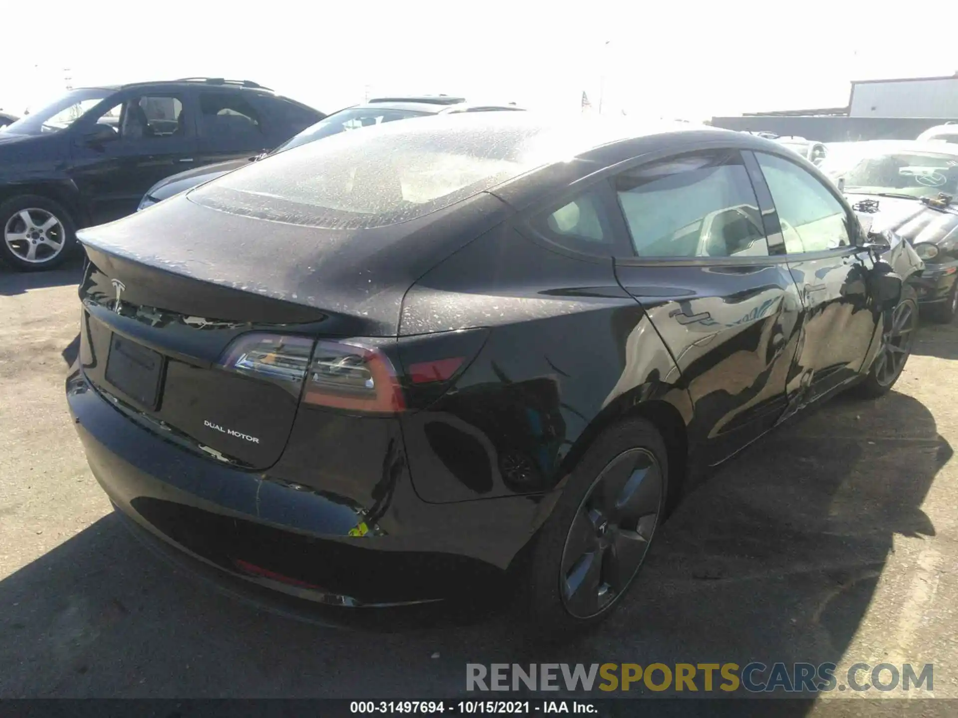 4 Photograph of a damaged car 5YJ3E1EB2MF877157 TESLA MODEL 3 2021