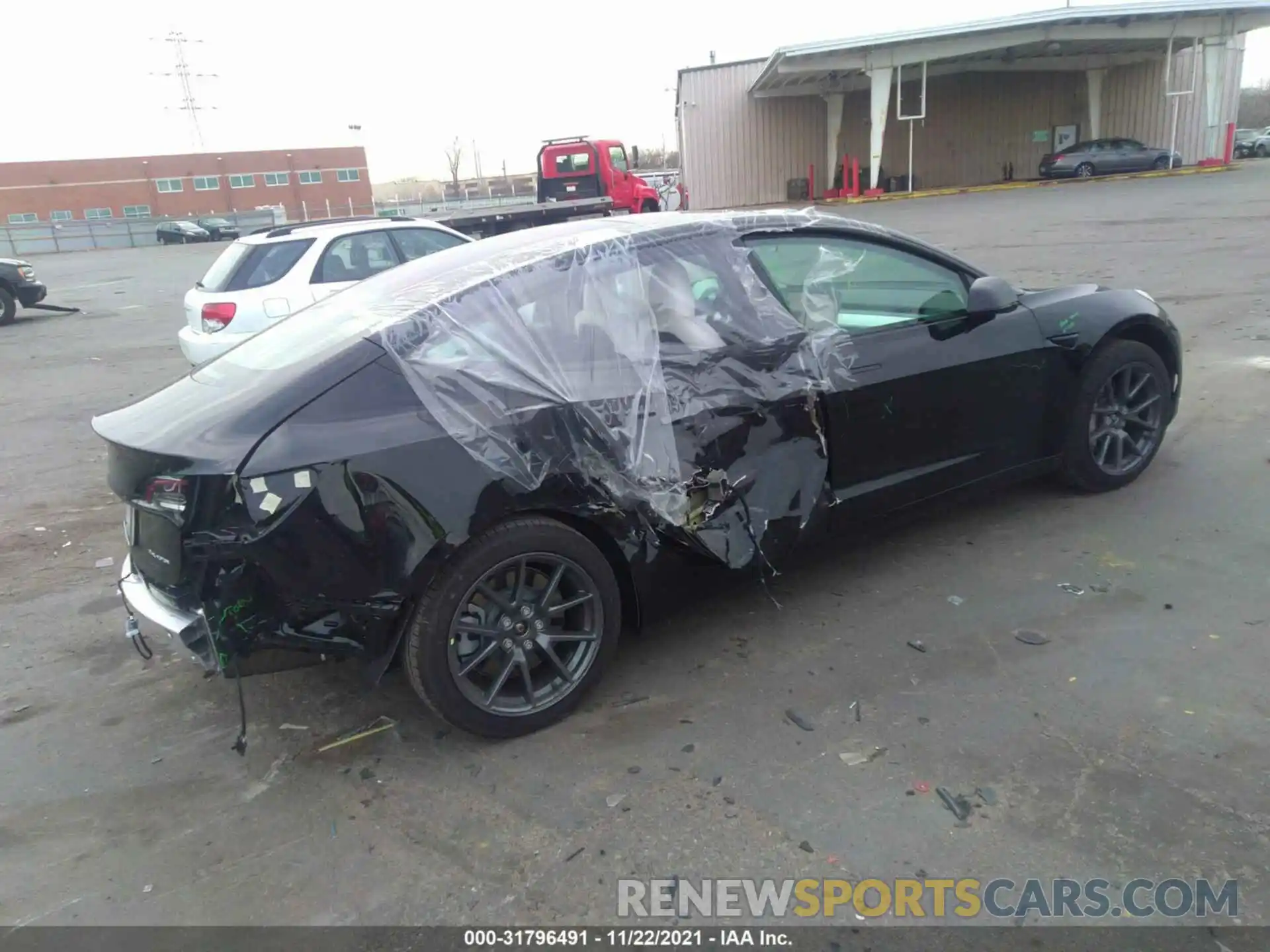 4 Photograph of a damaged car 5YJ3E1EB2MF975640 TESLA MODEL 3 2021