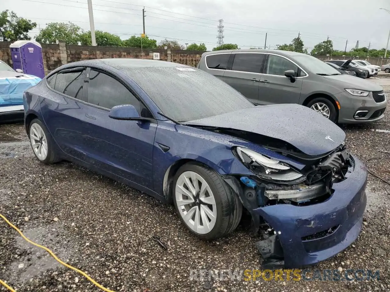4 Photograph of a damaged car 5YJ3E1EB3MF980135 TESLA MODEL 3 2021