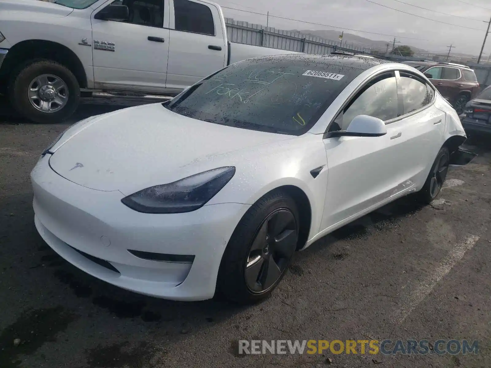 2 Photograph of a damaged car 5YJ3E1EB4MF999079 TESLA MODEL 3 2021