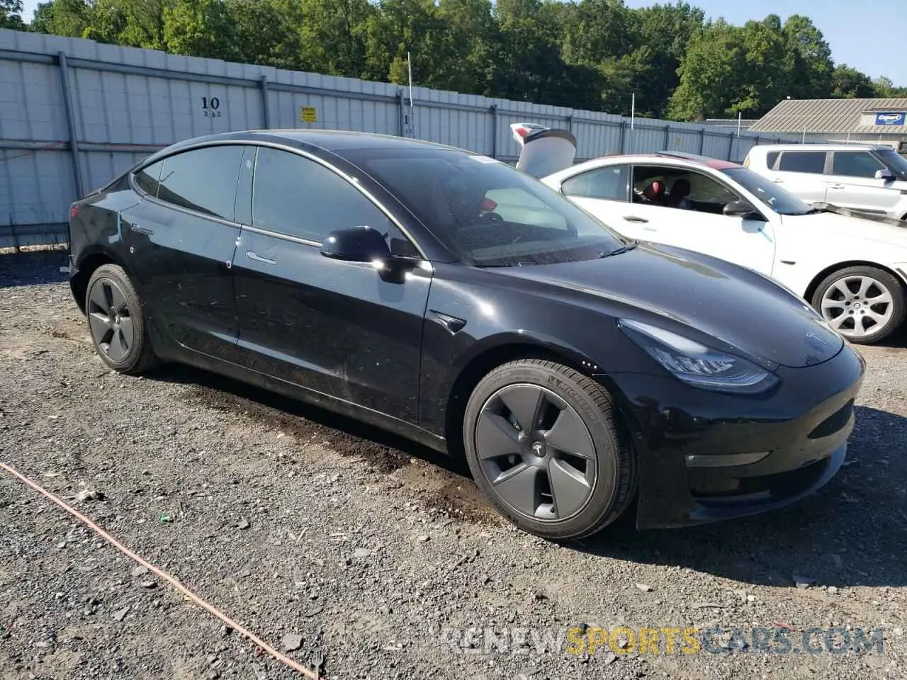 4 Photograph of a damaged car 5YJ3E1EB7MF858748 TESLA MODEL 3 2021