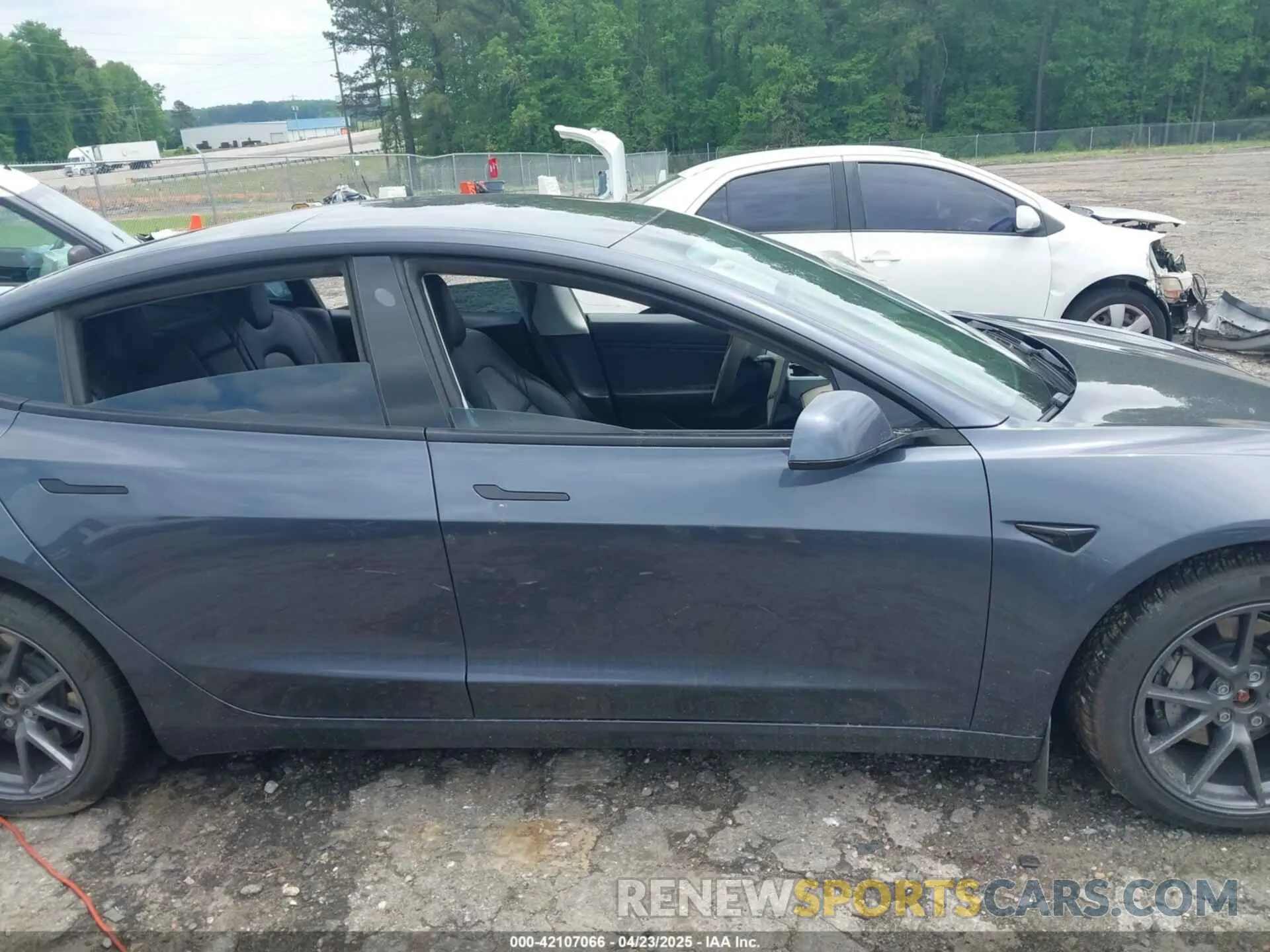 12 Photograph of a damaged car 5YJ3E1EB7MF923632 TESLA MODEL 3 2021