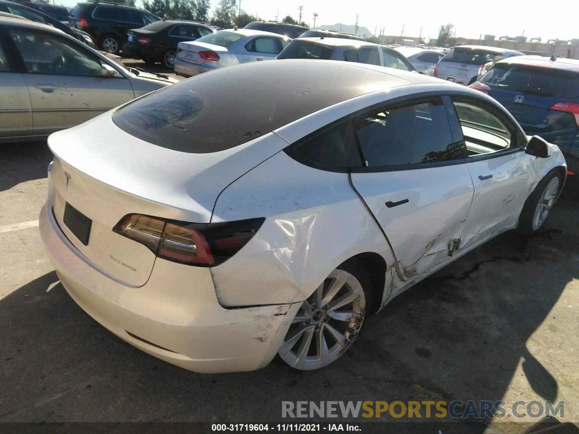 4 Photograph of a damaged car 5YJ3E1EB9MF078847 TESLA MODEL 3 2021