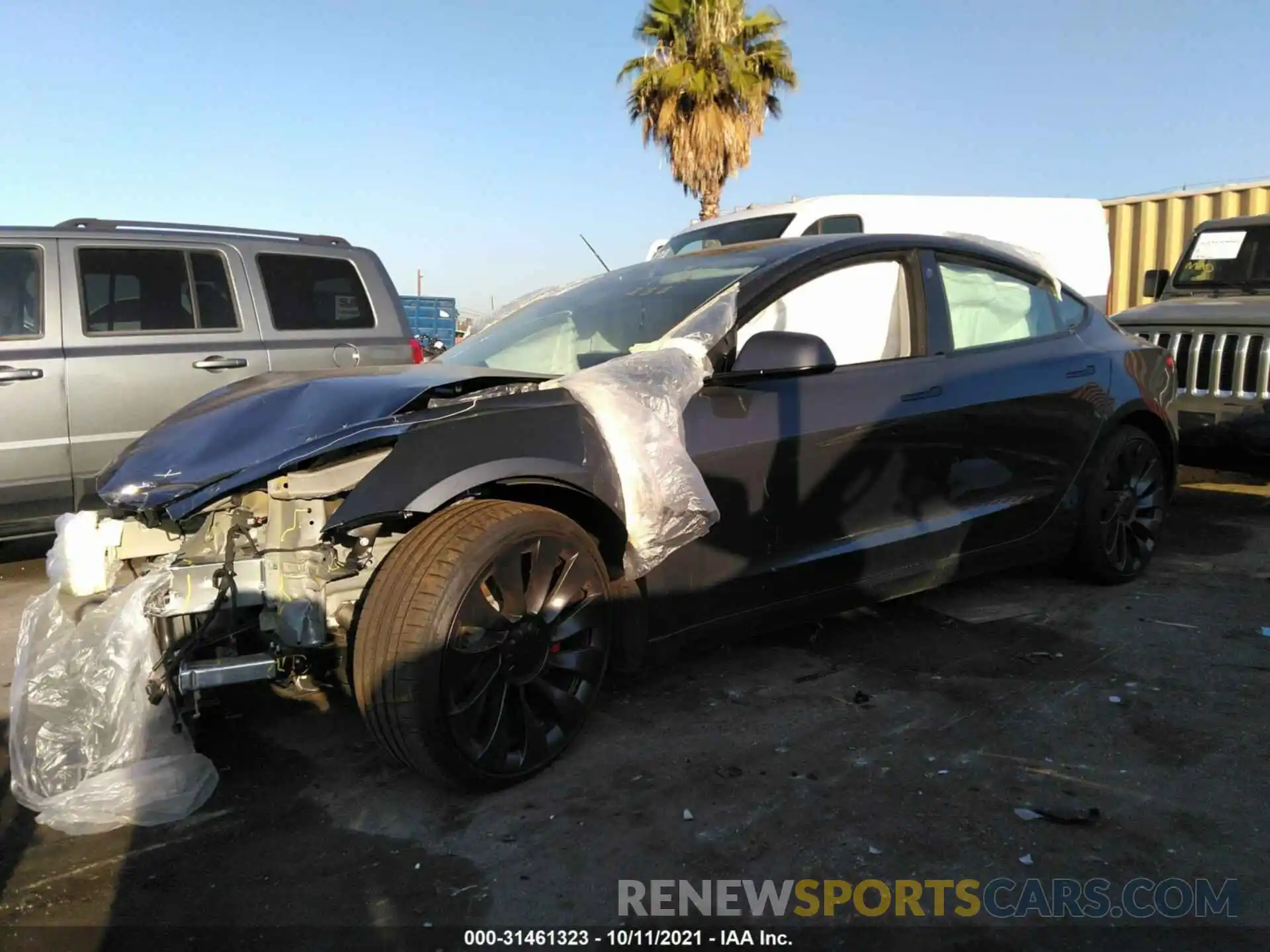 2 Photograph of a damaged car 5YJ3E1EC4MF990567 TESLA MODEL 3 2021