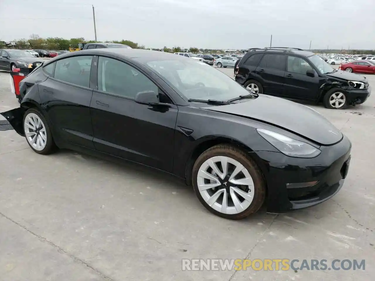 4 Photograph of a damaged car 5YJ3E1EA0NF185200 TESLA MODEL 3 2022