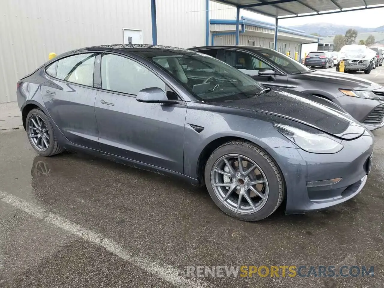4 Photograph of a damaged car 5YJ3E1EA0NF370055 TESLA MODEL 3 2022