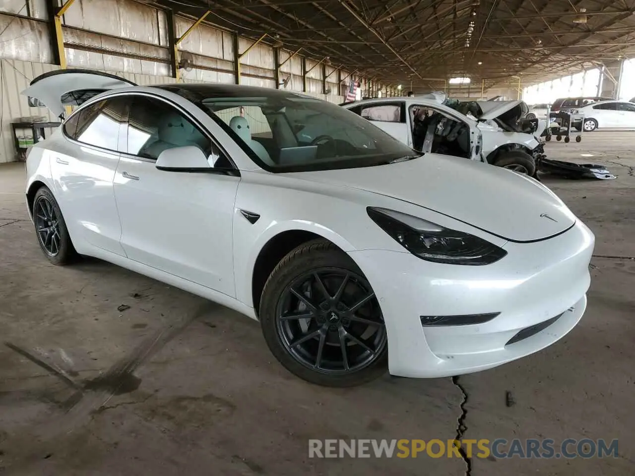 4 Photograph of a damaged car 5YJ3E1EA1NF358612 TESLA MODEL 3 2022