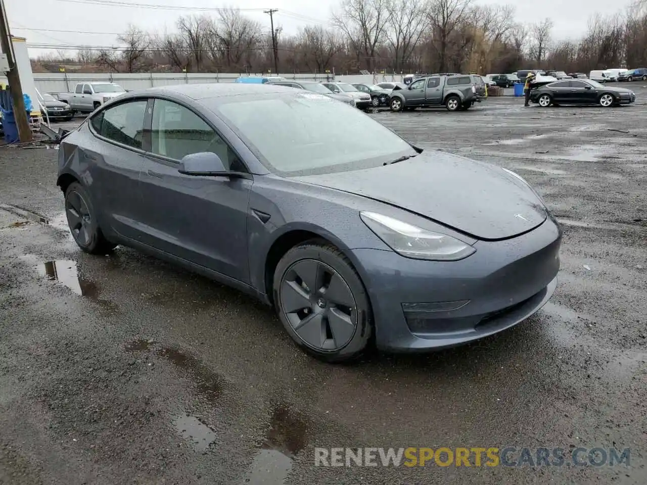 4 Photograph of a damaged car 5YJ3E1EA1NF371246 TESLA MODEL 3 2022