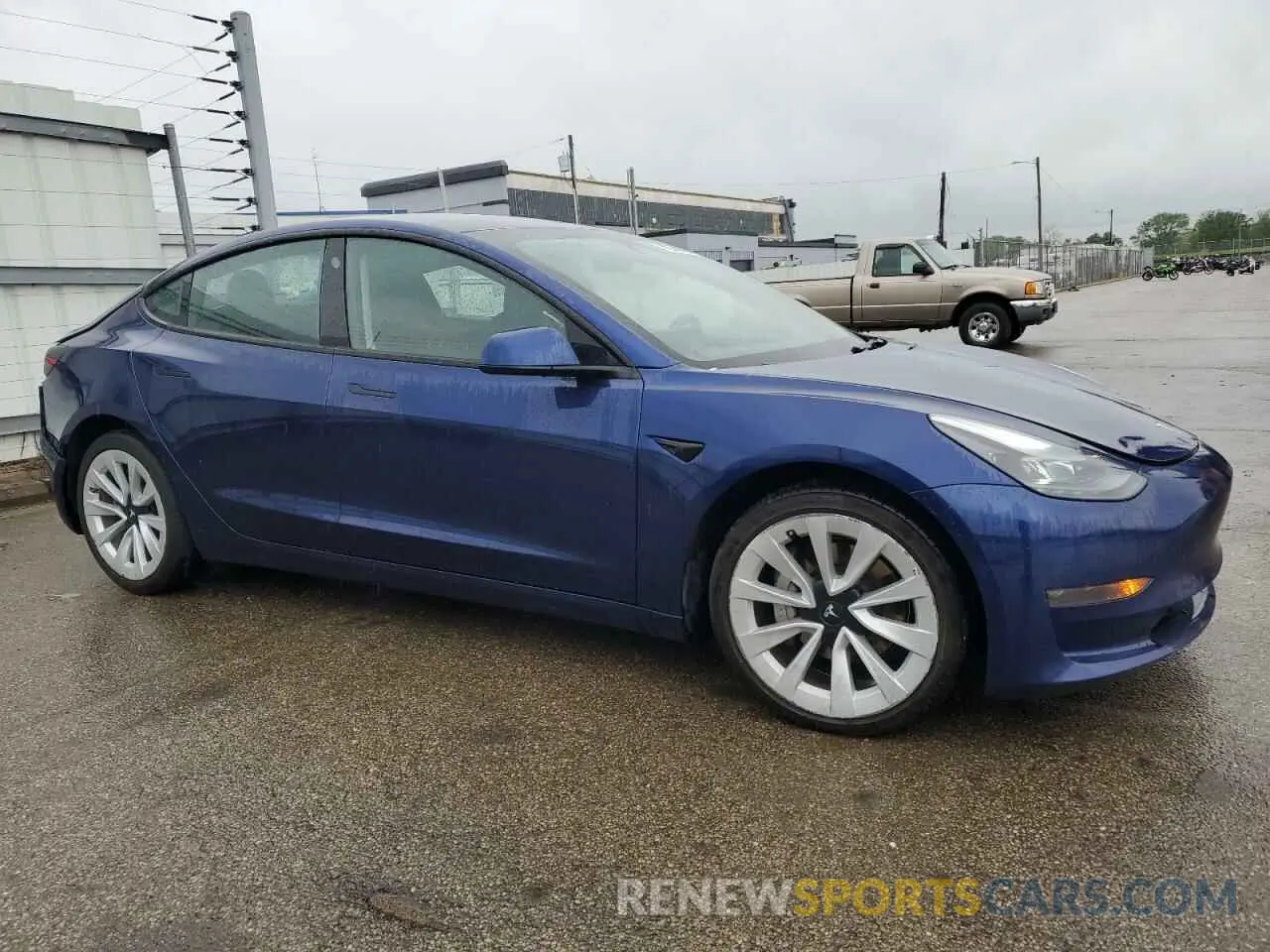 4 Photograph of a damaged car 5YJ3E1EA1NF371585 TESLA MODEL 3 2022