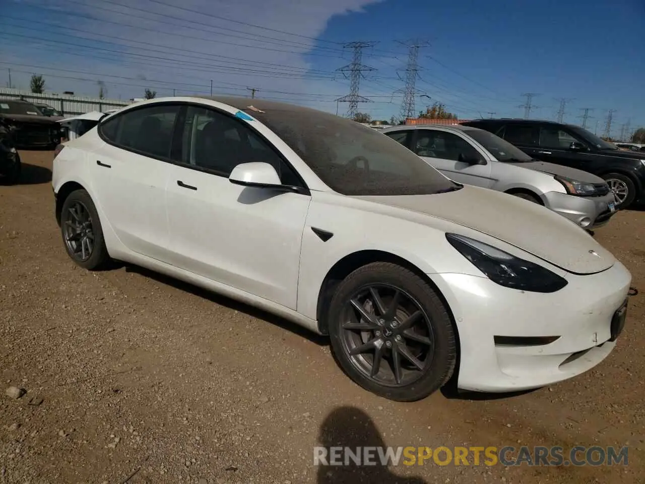 4 Photograph of a damaged car 5YJ3E1EA6NF231046 TESLA MODEL 3 2022