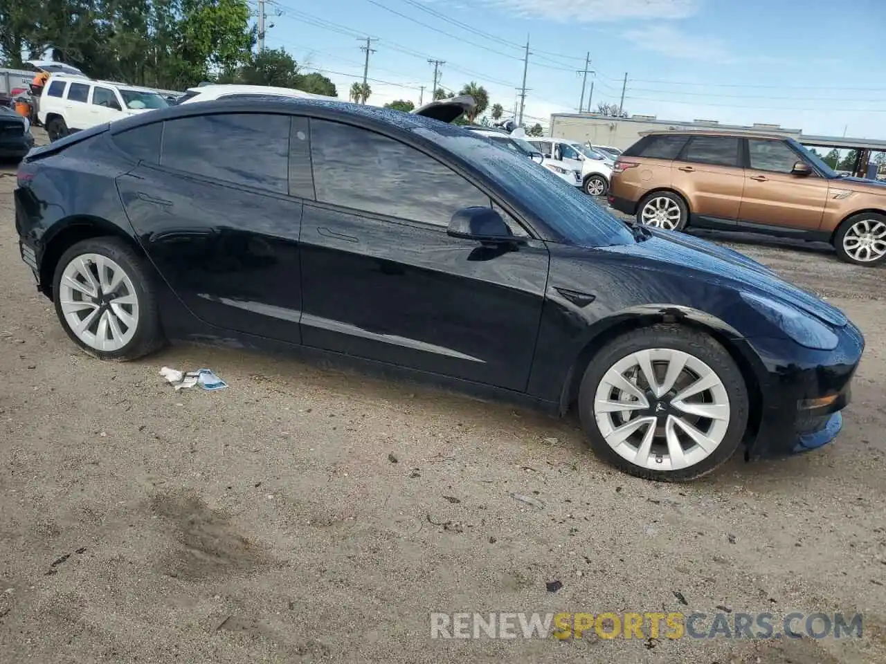 4 Photograph of a damaged car 5YJ3E1EA6NF239857 TESLA MODEL 3 2022