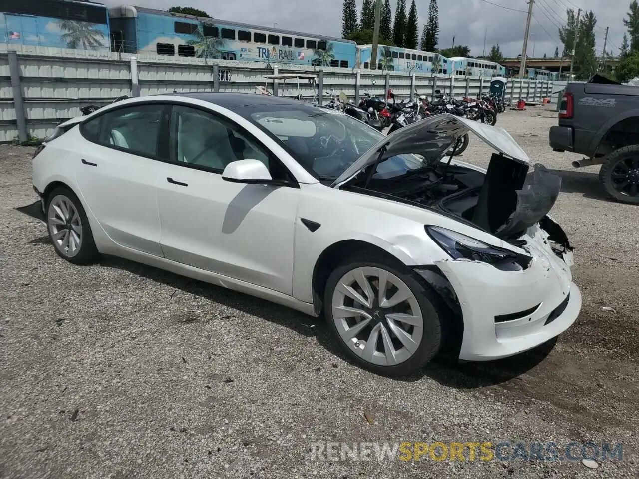4 Photograph of a damaged car 5YJ3E1EA7NF328935 TESLA MODEL 3 2022