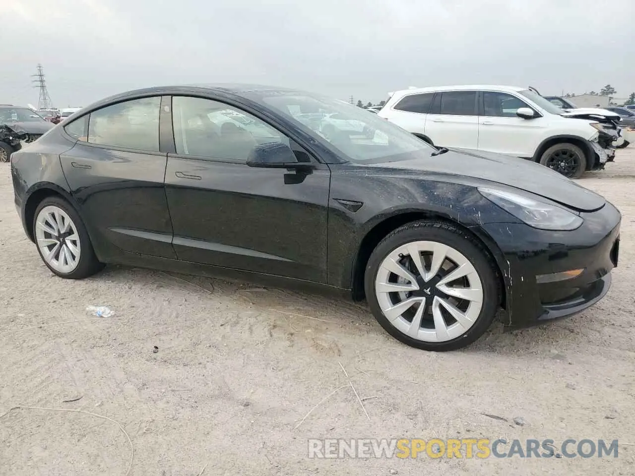 4 Photograph of a damaged car 5YJ3E1EA9NF201815 TESLA MODEL 3 2022