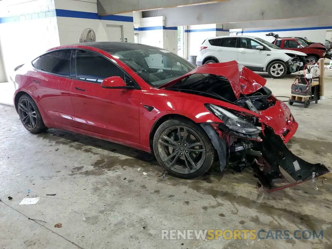 4 Photograph of a damaged car 5YJ3E1EAXNF188900 TESLA MODEL 3 2022