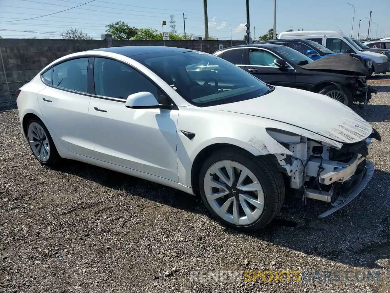 4 Photograph of a damaged car 5YJ3E1EAXNF290276 TESLA MODEL 3 2022