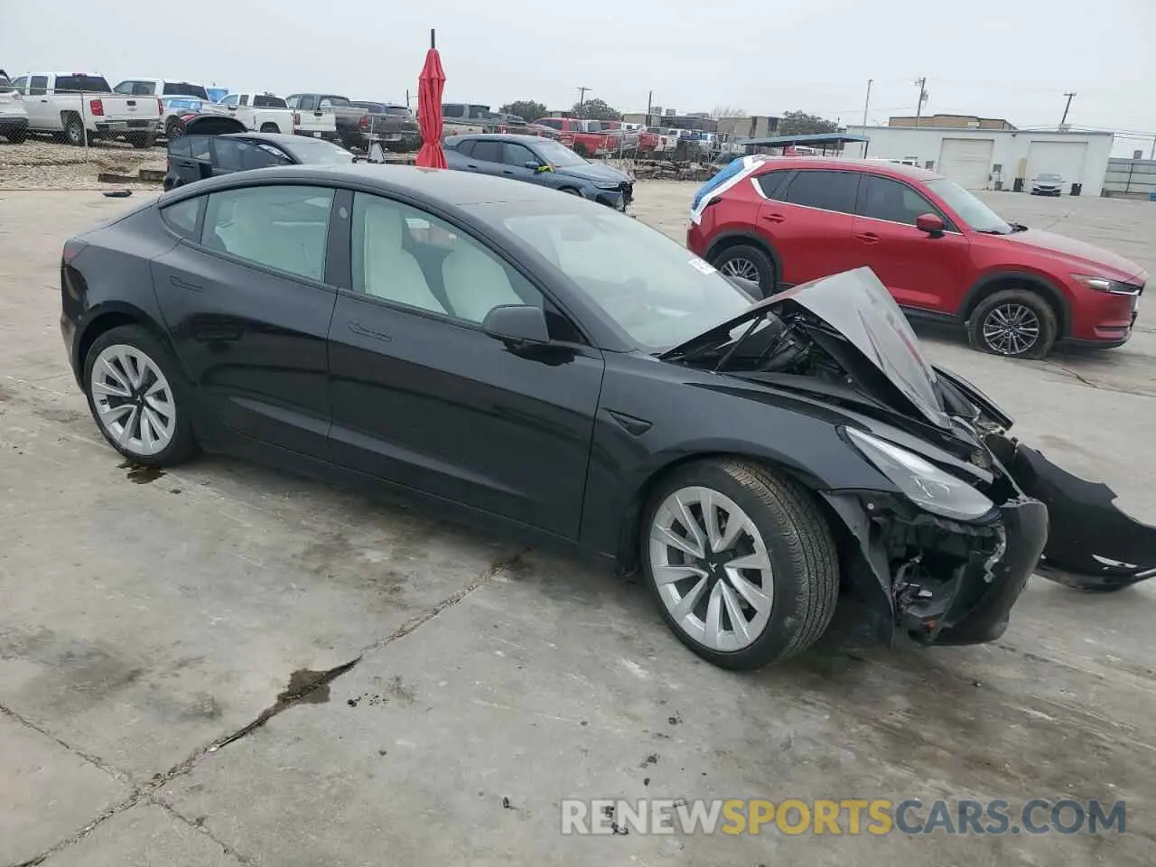 4 Photograph of a damaged car 5YJ3E1EAXNF310994 TESLA MODEL 3 2022