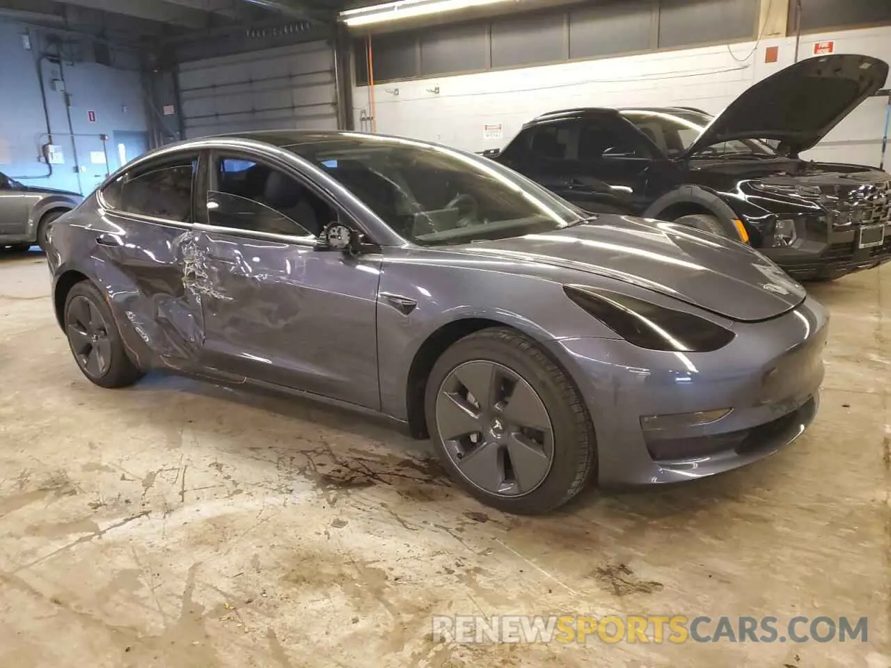 4 Photograph of a damaged car 5YJ3E1EAXNF313989 TESLA MODEL 3 2022