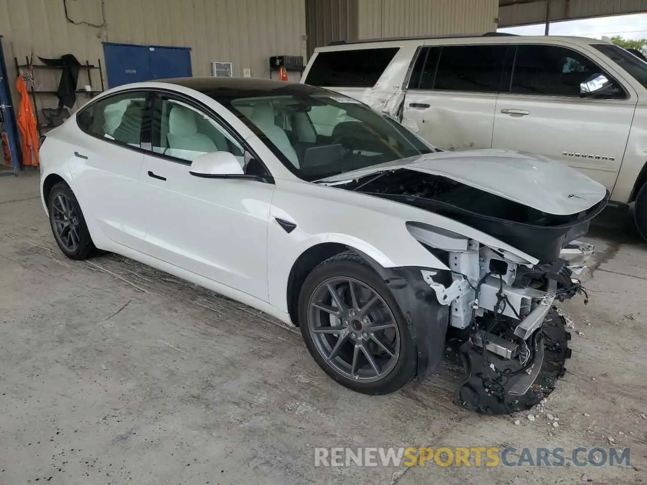 4 Photograph of a damaged car 5YJ3E1EAXNF321803 TESLA MODEL 3 2022