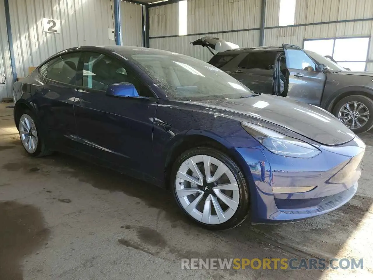 4 Photograph of a damaged car 5YJ3E1EAXNF370452 TESLA MODEL 3 2022