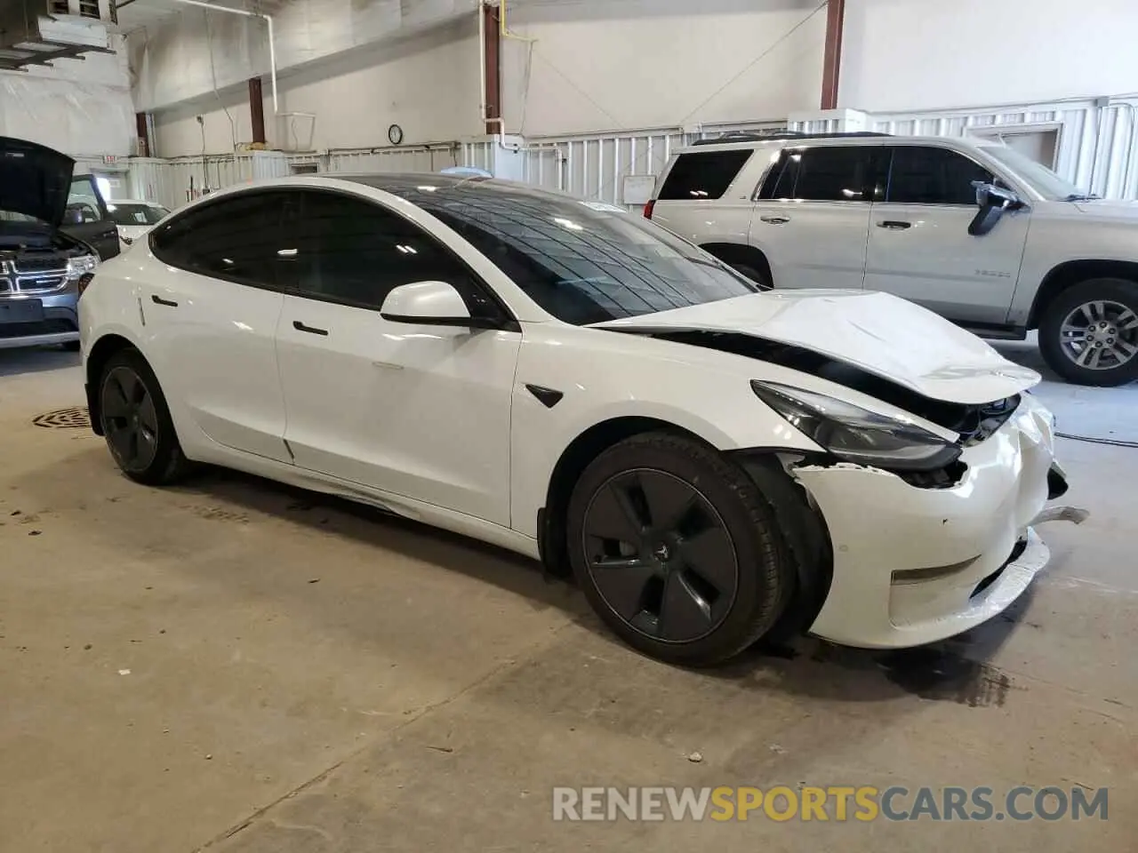 4 Photograph of a damaged car 5YJ3E1EB0NF118654 TESLA MODEL 3 2022
