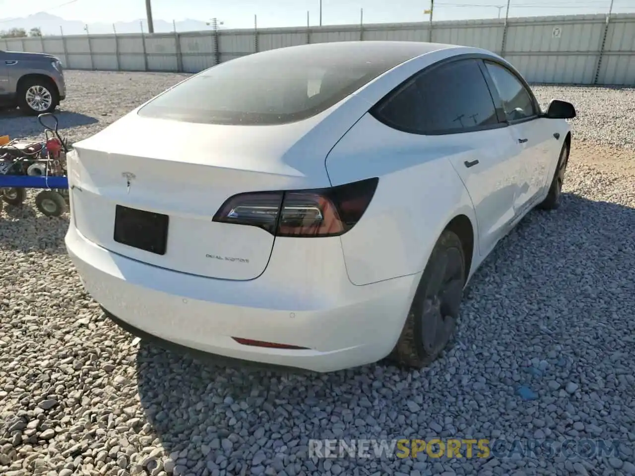 4 Photograph of a damaged car 5YJ3E1EB0NF184377 TESLA MODEL 3 2022