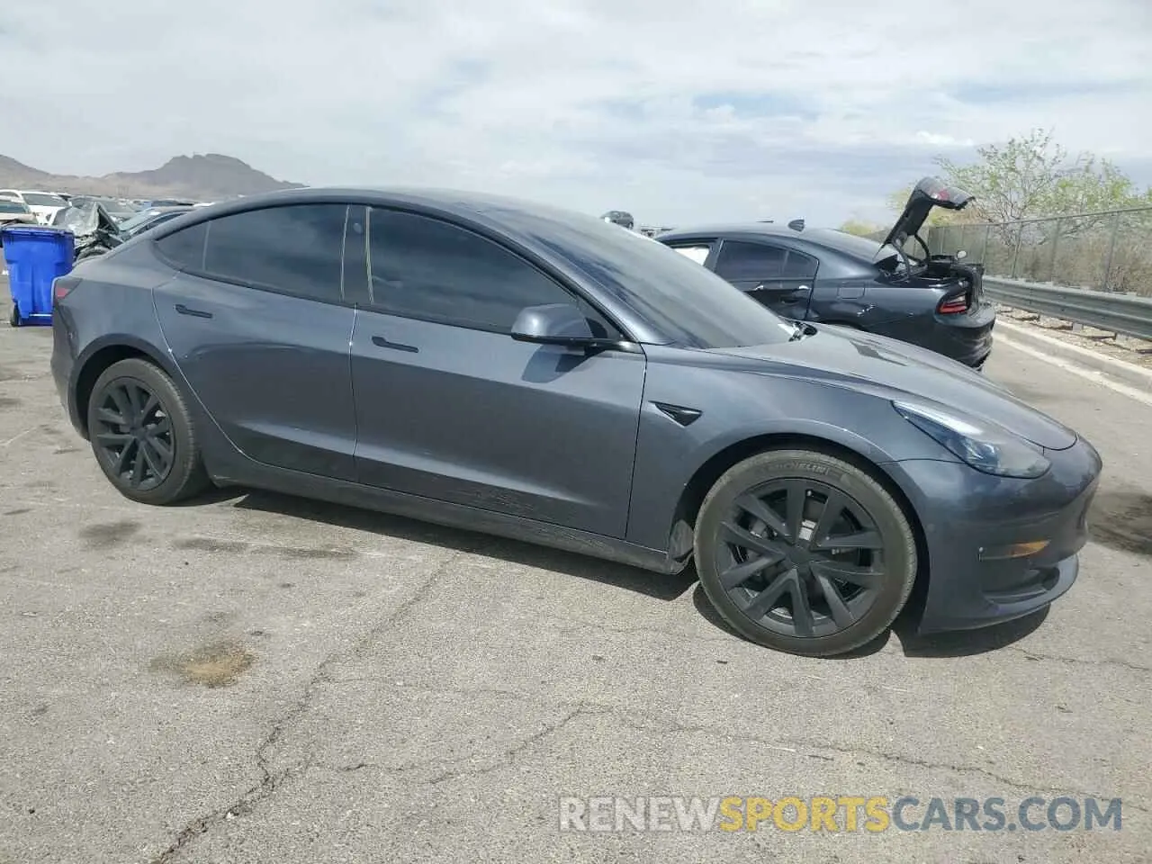 4 Photograph of a damaged car 5YJ3E1EB0NF329143 TESLA MODEL 3 2022