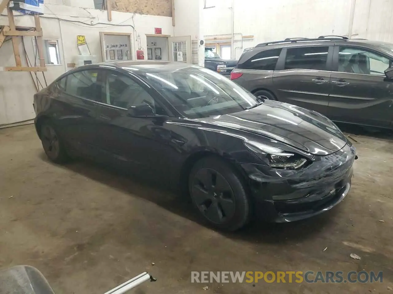 4 Photograph of a damaged car 5YJ3E1EB1NF110210 TESLA MODEL 3 2022