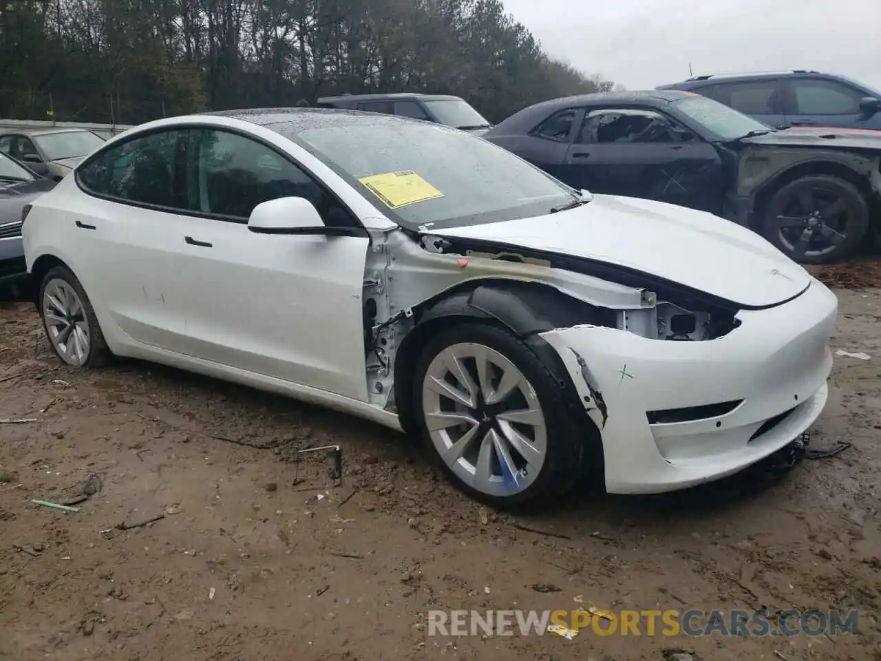 4 Photograph of a damaged car 5YJ3E1EB1NF185599 TESLA MODEL 3 2022