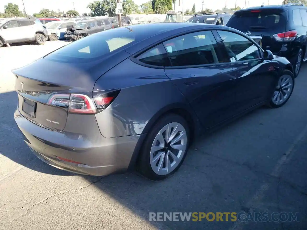 4 Photograph of a damaged car 5YJ3E1EB1NF192391 TESLA MODEL 3 2022