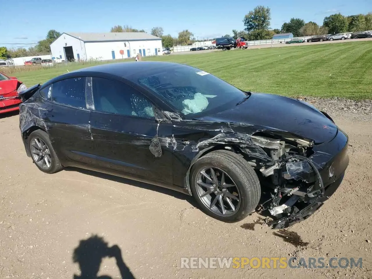 4 Photograph of a damaged car 5YJ3E1EB1NF233859 TESLA MODEL 3 2022