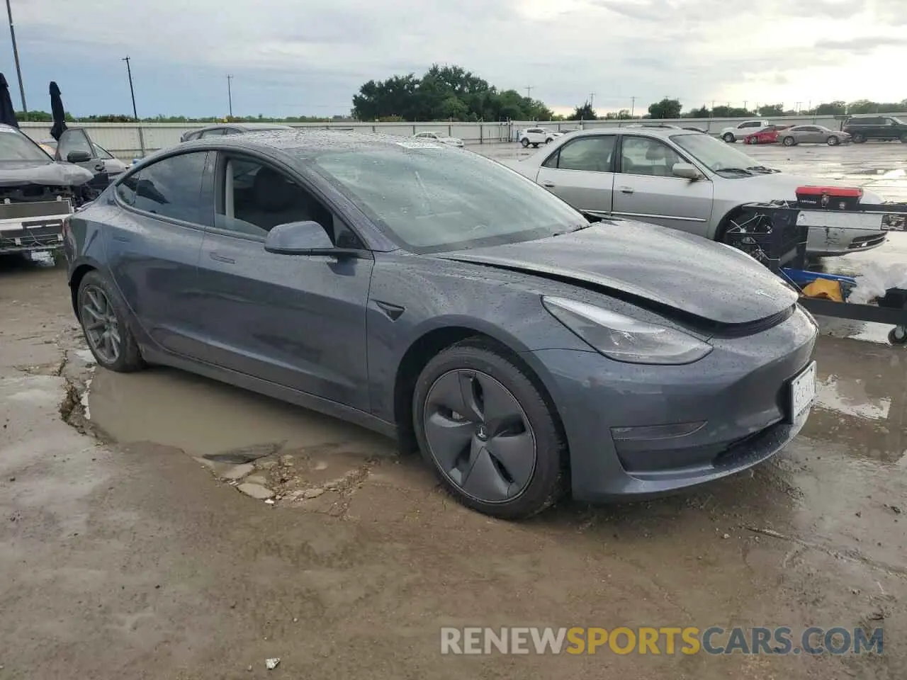 4 Photograph of a damaged car 5YJ3E1EB1NF321522 TESLA MODEL 3 2022
