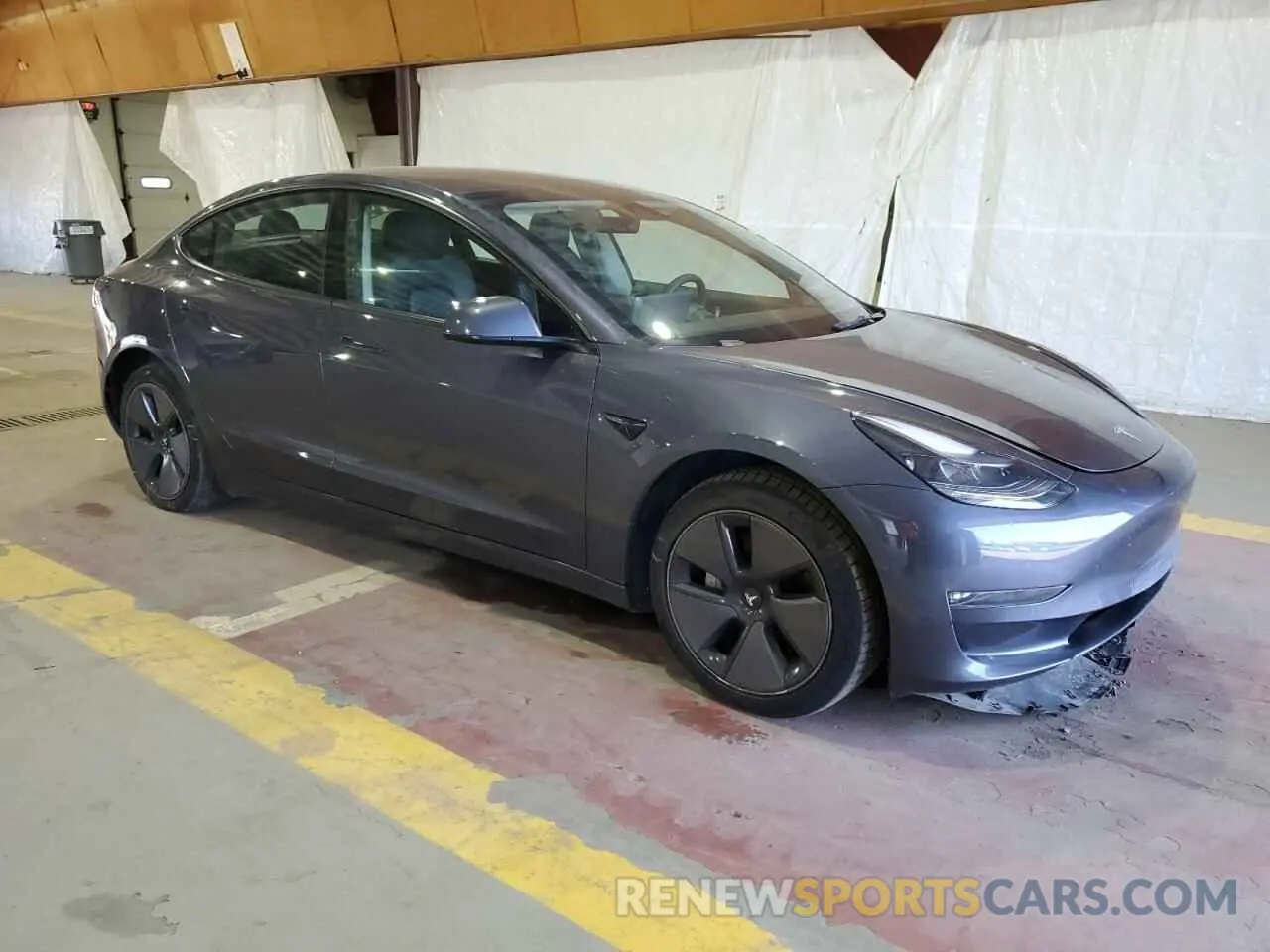 4 Photograph of a damaged car 5YJ3E1EB2NF204922 TESLA MODEL 3 2022