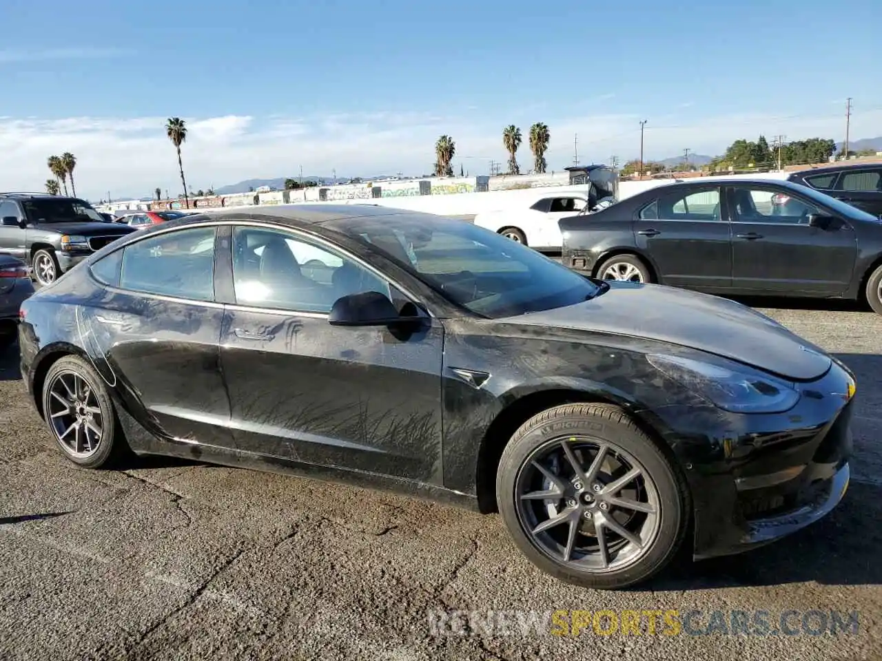 4 Photograph of a damaged car 5YJ3E1EB2NF234695 TESLA MODEL 3 2022