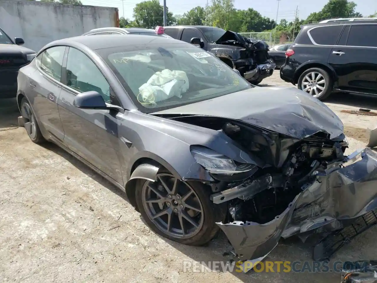 1 Photograph of a damaged car 5YJ3E1EB5NF242886 TESLA MODEL 3 2022