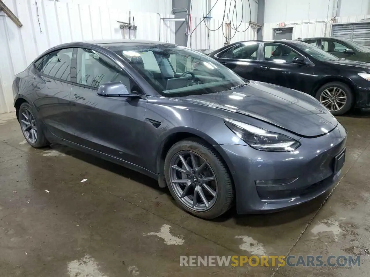 4 Photograph of a damaged car 5YJ3E1EB6NF227460 TESLA MODEL 3 2022